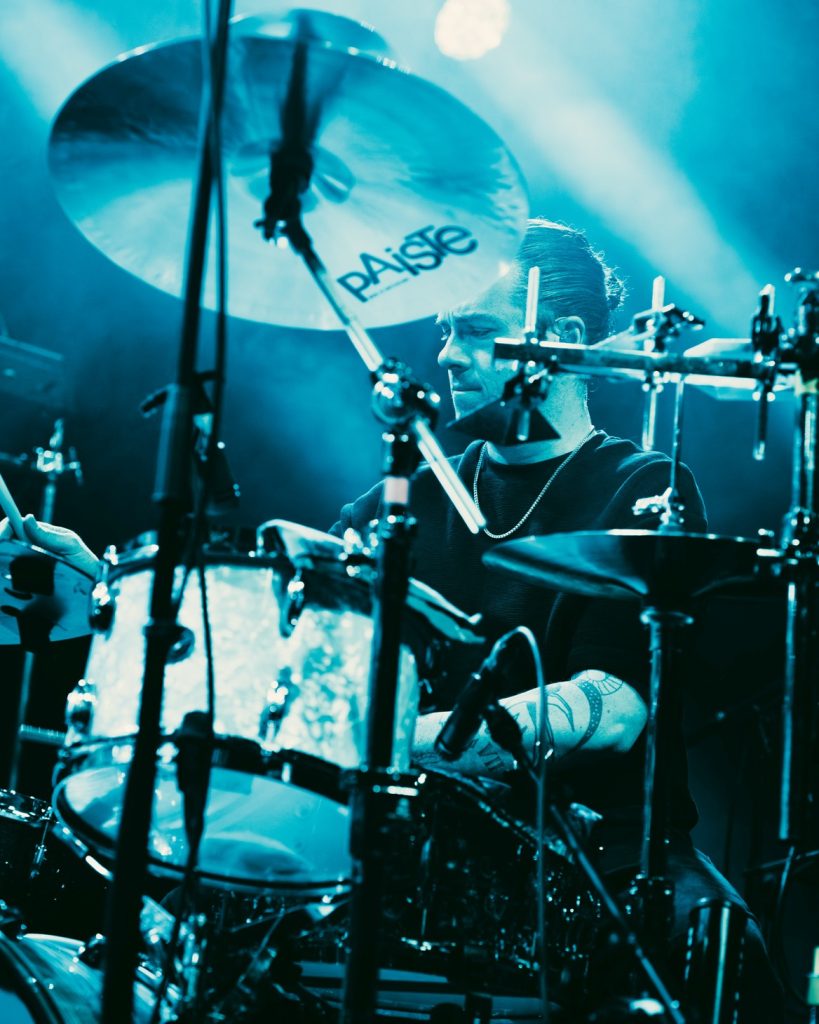 A near shot of Gareth Grover on stage at the drum kit