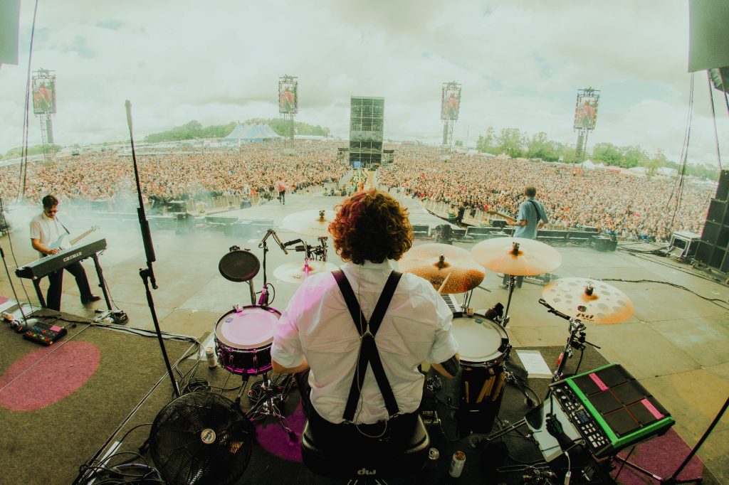 A back view of Gareth Grover at the drum kit, on the Main Stage at the Download Festival 2024, with Frank Carter and the Rattlesnakes