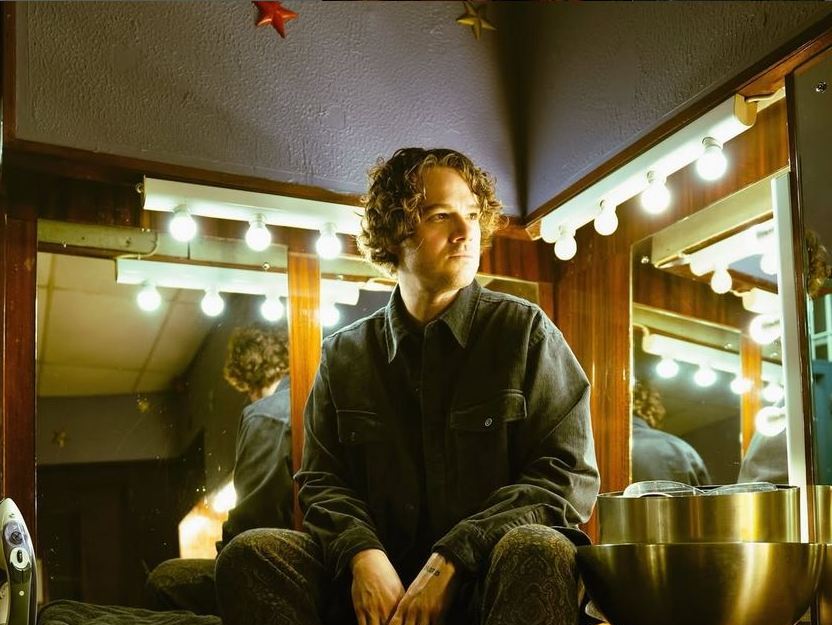 Gareth waiting to go on stage in a green room